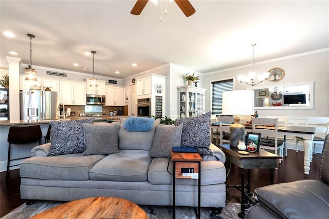 6628 Rivergreen Rd, Flowery Branch, GA 30542 - living room featuring ornamental molding, a chandelier, dark wood-style floors, a ceiling fan, and recessed lighting