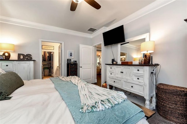 6628 Rivergreen Rd, Flowery Branch, GA 30542 - bedroom featuring ornamental molding, wood finished floors, ceiling fan, and a spacious closet