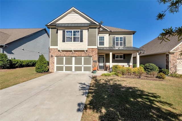 6628 Rivergreen Rd, Flowery Branch, GA 30542 - craftsman-style home with a standing seam roof, stone siding, concrete driveway, a porch, and a front yard