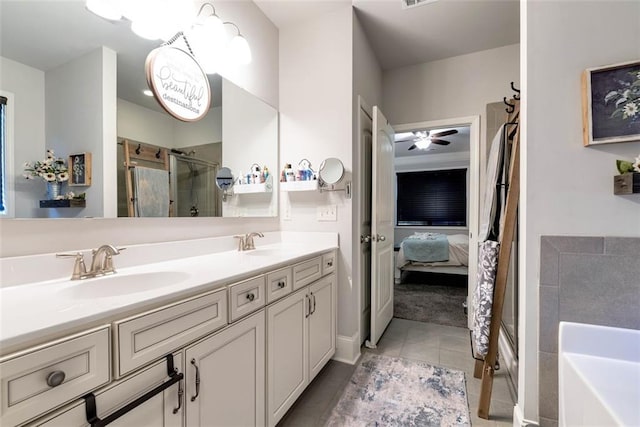 6628 Rivergreen Rd, Flowery Branch, GA 30542 - ensuite bathroom with a stall shower, double vanity, tile patterned floors, a bath, and ceiling fan