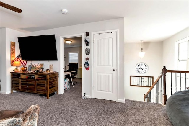 6628 Rivergreen Rd, Flowery Branch, GA 30542 - living area featuring carpet, a desk, and baseboards