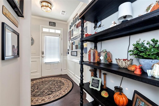 6628 Rivergreen Rd, Flowery Branch, GA 30542 - entryway featuring crown molding, dark wood-style flooring, and a wainscoted wall