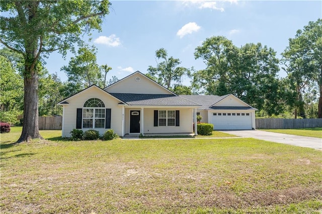 ranch-style home featuring a front yard, driveway, fence, and a garage