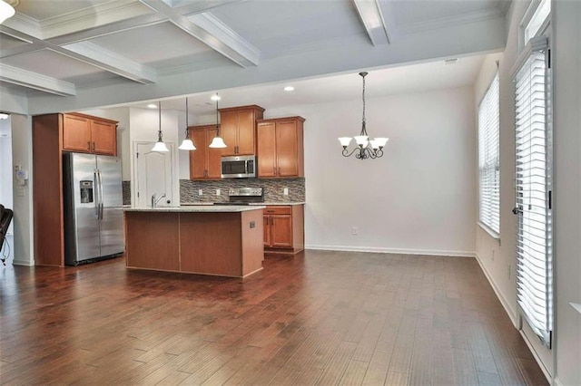 kitchen featuring plenty of natural light, decorative light fixtures, appliances with stainless steel finishes, and dark wood-type flooring