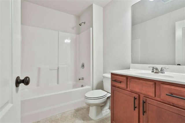 full bathroom with washtub / shower combination, tile patterned flooring, toilet, and vanity