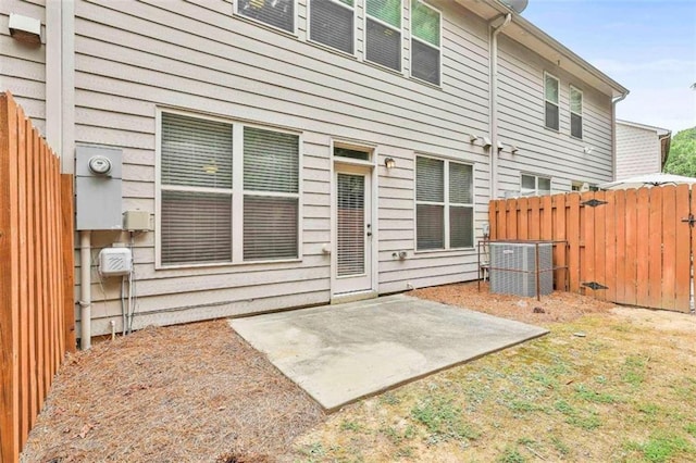 back of house with a patio and fence