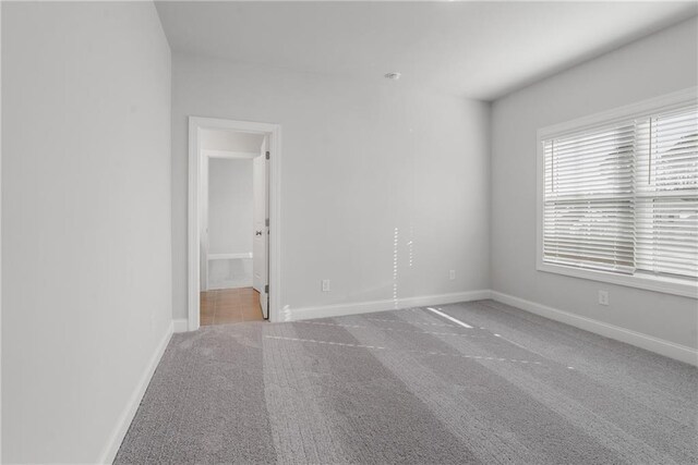 bathroom featuring tile patterned floors, toilet, and tiled shower / bath