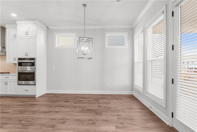 unfurnished room featuring dark hardwood / wood-style floors, a raised ceiling, and ornamental molding