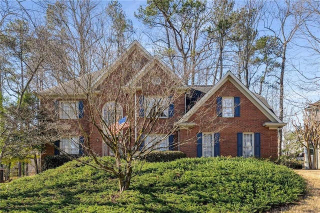 view of front of house featuring brick siding