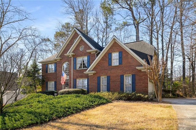 view of front of home featuring brick siding