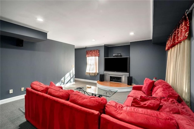 living area featuring carpet floors, recessed lighting, a fireplace, and baseboards