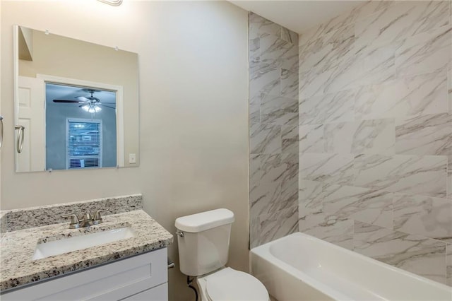 bathroom featuring toilet, shower / bathing tub combination, and vanity