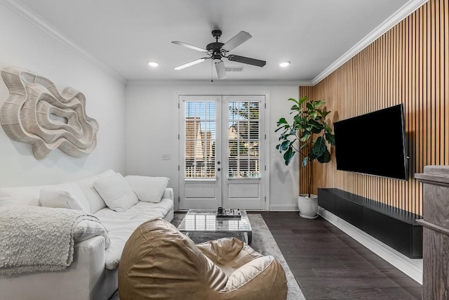 living room featuring ceiling fan, crown molding, and dark hardwood / wood-style flooring