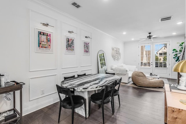 dining room with ceiling fan, dark hardwood / wood-style floors, and crown molding