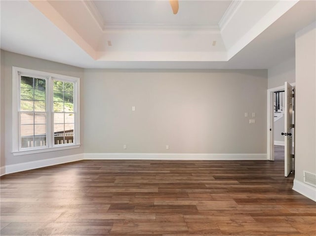 11405 Donnington Dr, Duluth, GA 30097 - empty room with a raised ceiling, wood finished floors, and crown molding
