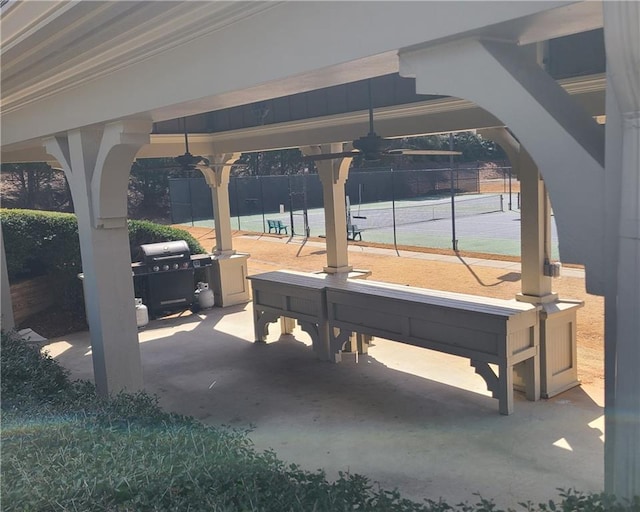 view of patio / terrace featuring fence, ceiling fan, and grilling area