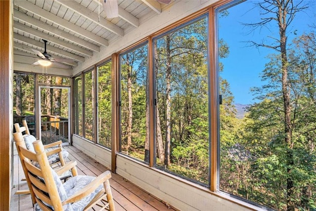 unfurnished sunroom with wood ceiling and vaulted ceiling with beams