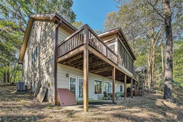 back of house with a patio and central AC