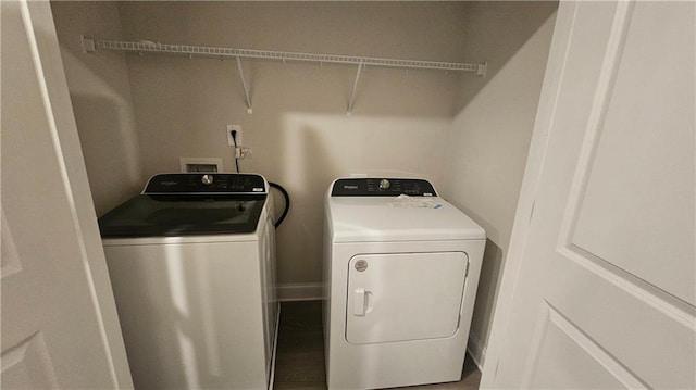 clothes washing area with independent washer and dryer