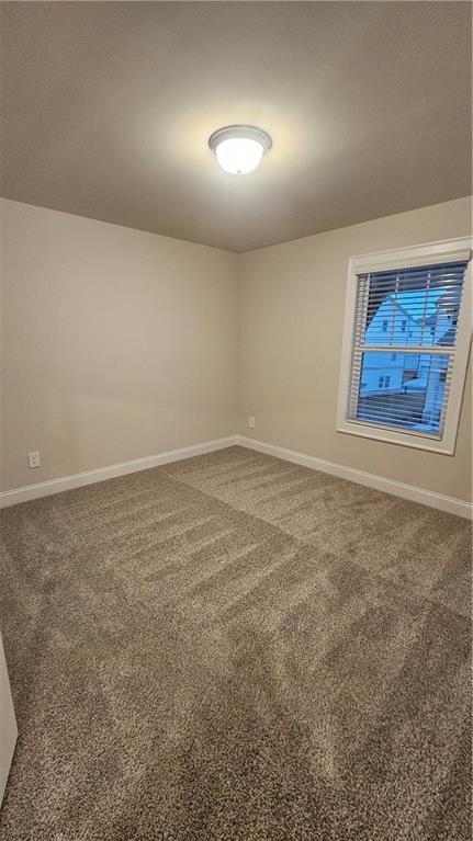 unfurnished room with carpet