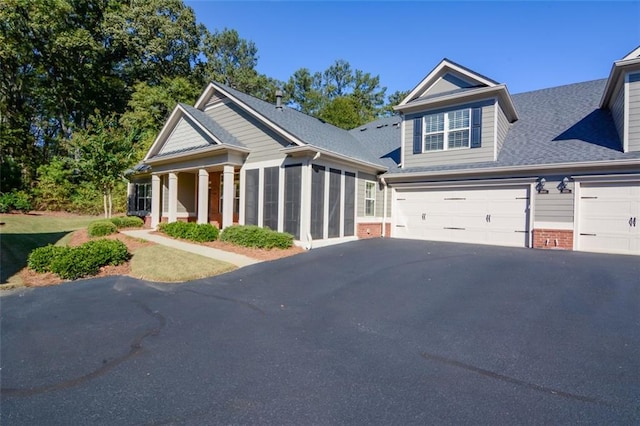 craftsman house with a garage