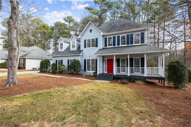 view of front of property with a front yard and covered porch