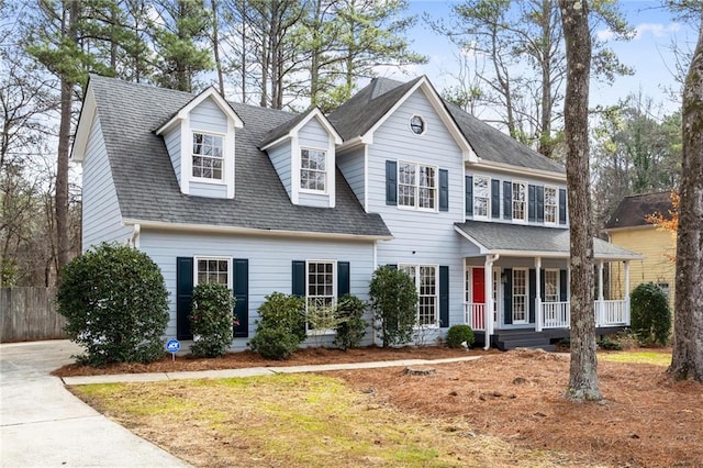 view of front of home with a porch and a front lawn