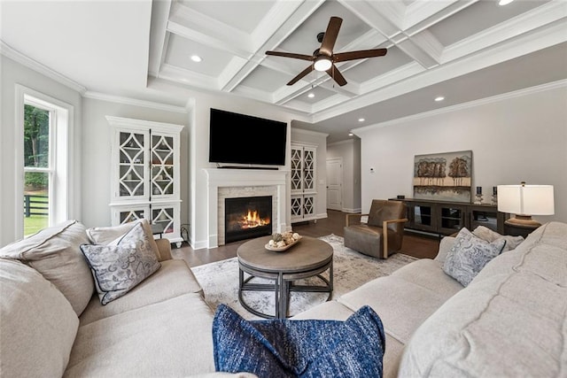 107 Equest Dr, Canton, GA 30115 - living area featuring wood finished floors, a ceiling fan, beamed ceiling, a warm lit fireplace, and coffered ceiling