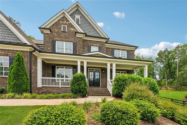 107 Equest Dr, Canton, GA 30115 - view of front of house with brick siding, a porch, and french doors