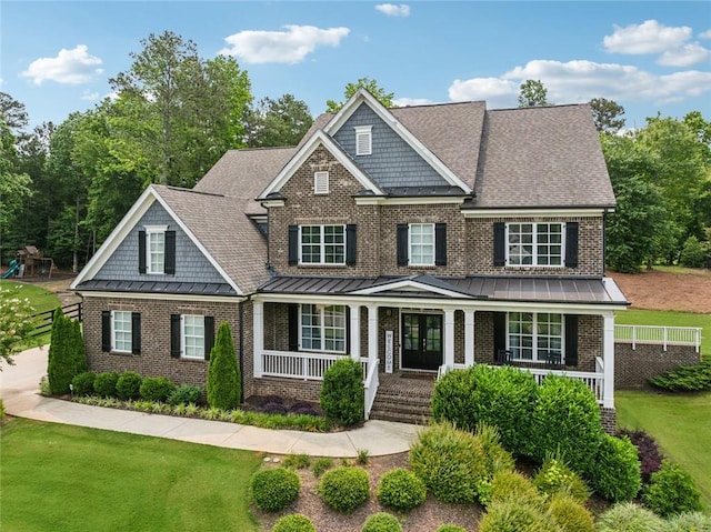 107 Equest Dr, Canton, GA 30115 - view of front of house featuring brick siding, a porch, a standing seam roof, and a front lawn