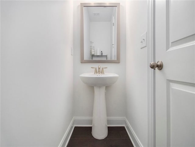 bathroom with tile patterned floors