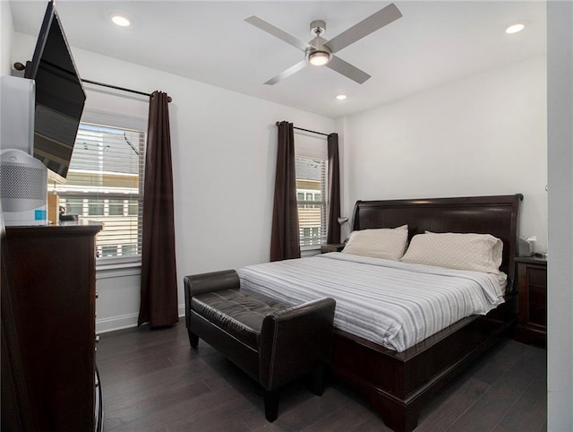 bedroom featuring ceiling fan and dark hardwood / wood-style flooring