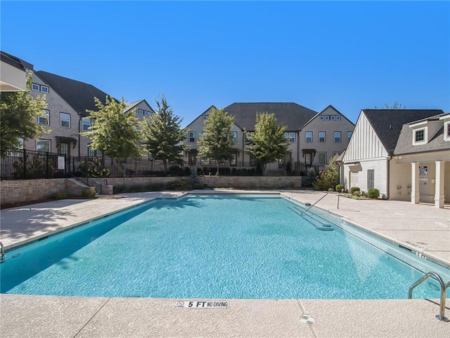 view of swimming pool featuring a patio