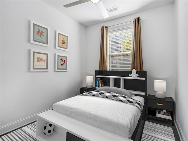 bedroom featuring ceiling fan and light colored carpet