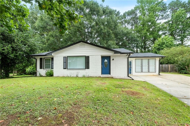 1694 Pheasant Dr, Atlanta, GA 30238 - ranch-style house featuring brick siding, concrete driveway, and view of wooded area