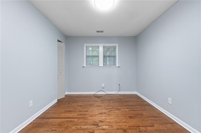 1694 Pheasant Dr, Atlanta, GA 30238 - unfurnished room featuring wood finished floors and a textured ceiling