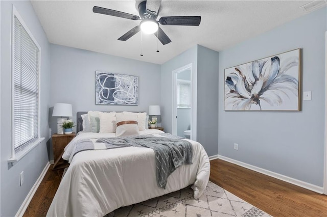1694 Pheasant Dr, Atlanta, GA 30238 - bedroom featuring wood finished floors, ensuite bathroom, and a ceiling fan