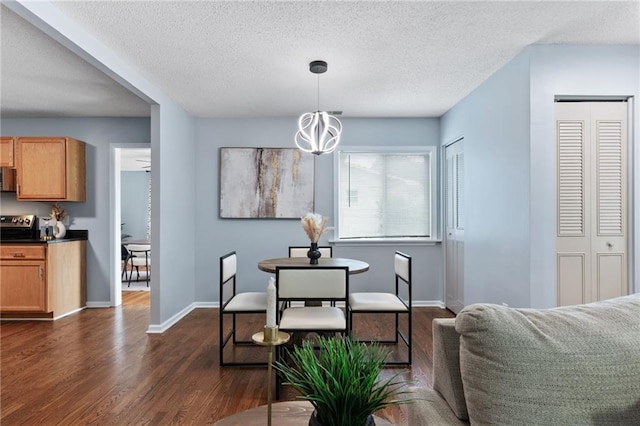 1694 Pheasant Dr, Atlanta, GA 30238 - dining room with a textured ceiling, dark wood-style floors, and a chandelier