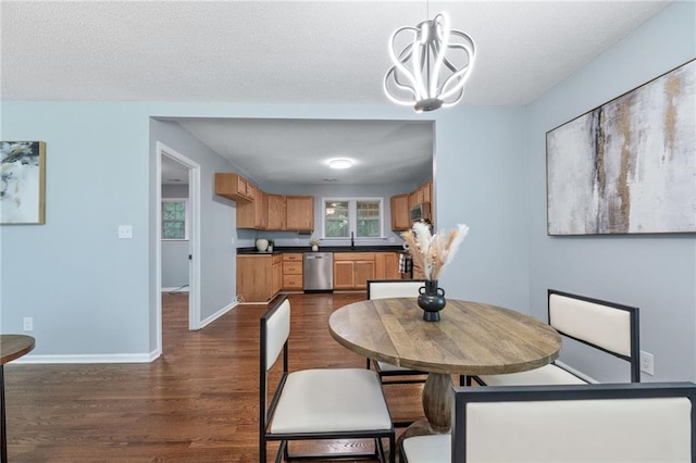 1694 Pheasant Dr, Atlanta, GA 30238 - dining area featuring dark wood-style flooring and a chandelier