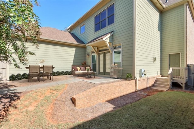 back of house with a patio