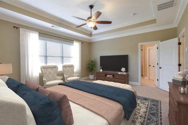 carpeted bedroom featuring a raised ceiling, ornamental molding, and ceiling fan