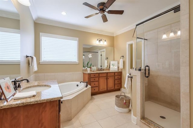 bathroom featuring independent shower and bath, vanity, ceiling fan, crown molding, and tile patterned floors