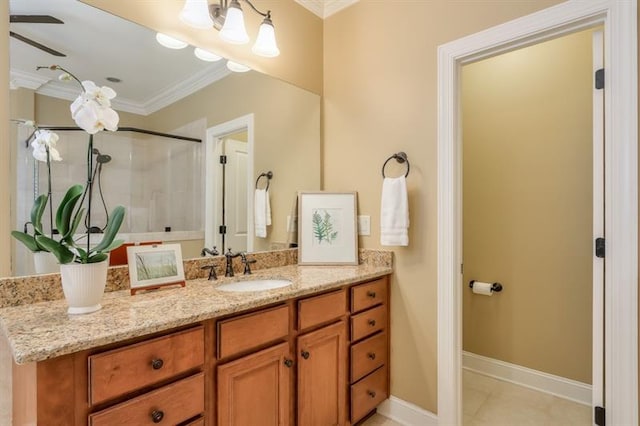 bathroom featuring an enclosed shower, ornamental molding, tile patterned flooring, and vanity