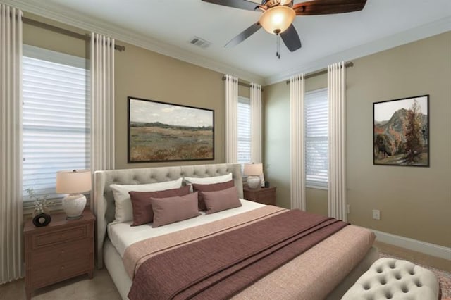 carpeted bedroom with crown molding and ceiling fan