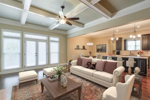 living room featuring coffered ceiling, beam ceiling, and dark hardwood / wood-style flooring