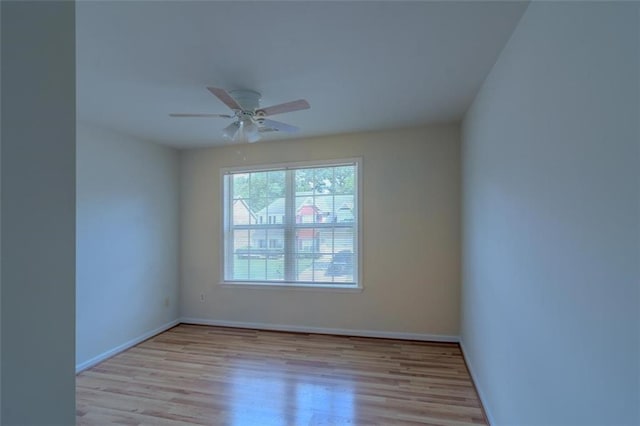 851 Roget Ct, Lawrenceville, GA 30045 - empty room with wood finished floors and a ceiling fan