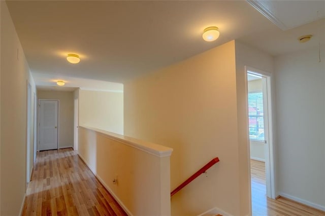 851 Roget Ct, Lawrenceville, GA 30045 - hallway featuring an upstairs landing, light wood-style flooring, and attic access
