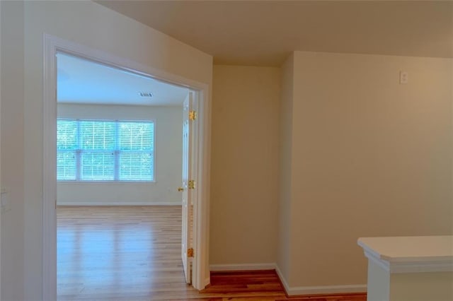 851 Roget Ct, Lawrenceville, GA 30045 - hallway featuring wood finished floors and baseboards