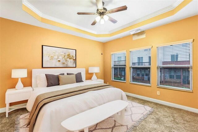 275 Blue Pointe Ct, Suwanee, GA 30024 - carpeted bedroom featuring a tray ceiling, ornamental molding, baseboards, and a ceiling fan