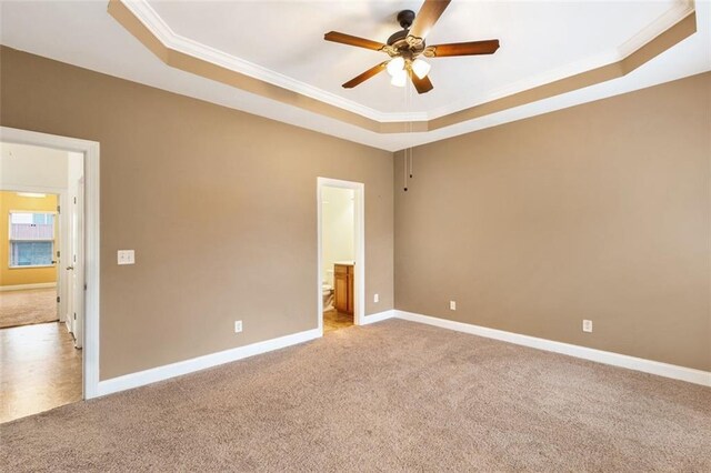 275 Blue Pointe Ct, Suwanee, GA 30024 - unfurnished bedroom featuring carpet flooring, ornamental molding, a tray ceiling, baseboards, and ensuite bath